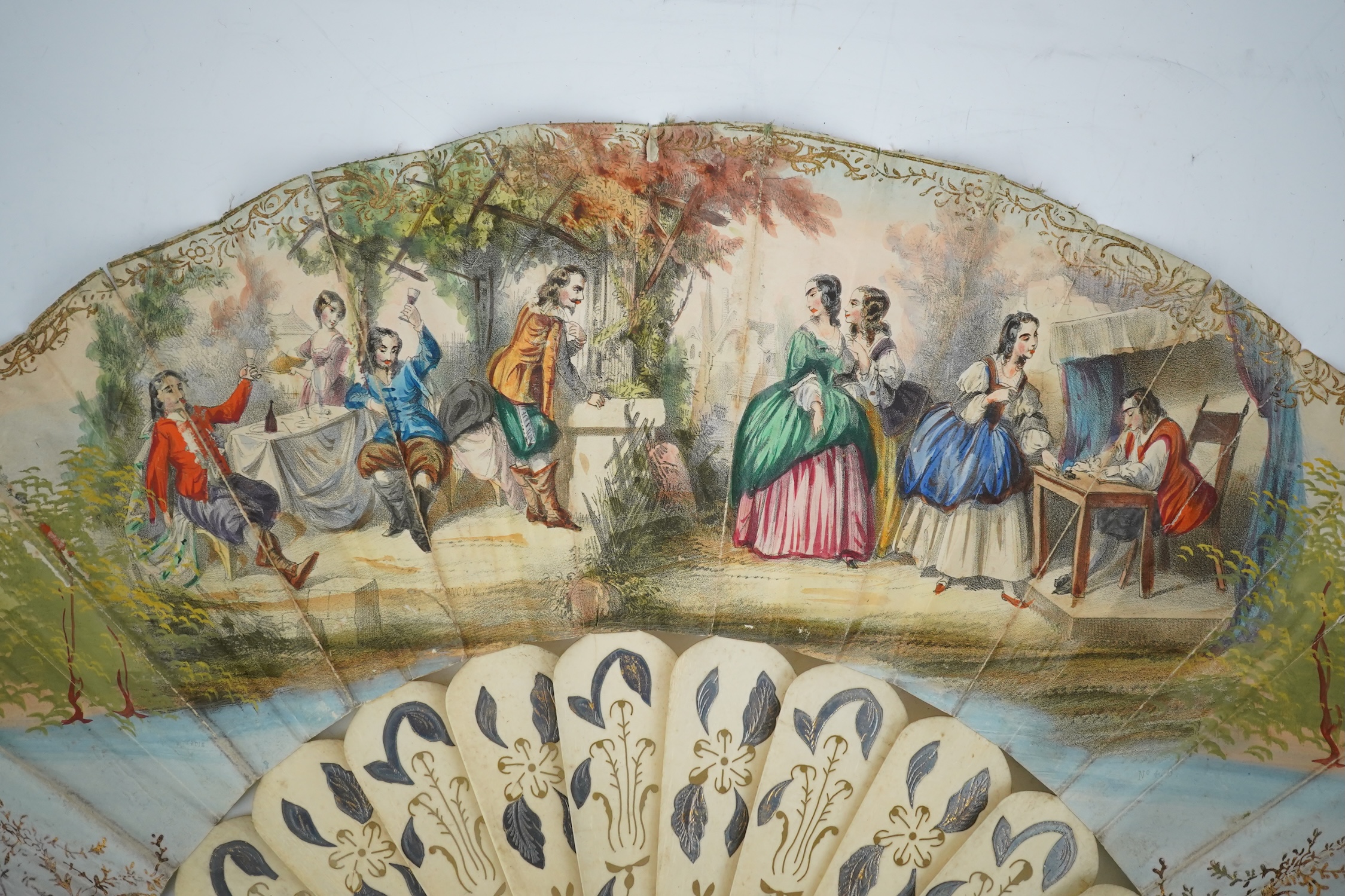 Three French fans: a mother of pearl and sequin fan boxed, a painted silk, feather and bone fan and a gilt decorated bone figural paper fan, the two bone fans having gilt mirrored mounts on the guards, figural paper fan